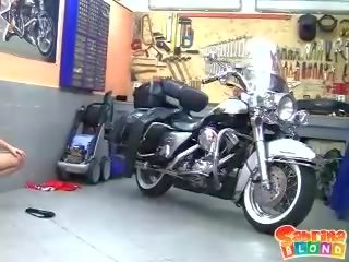 Horny blonde teen with small tits stripping by the motor bike